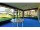 Relaxing screened porch with backyard view and patio table at 2608 Treehaven Dr, Deltona, FL 32738