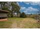 Large backyard with mature trees and open space at 262 Valencia Rd, Debary, FL 32713