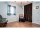 Bedroom with rocking chair, built-in closet, and wood floors at 262 Valencia Rd, Debary, FL 32713