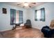 Bedroom with rocking chair and wood floors at 262 Valencia Rd, Debary, FL 32713