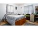 Bedroom with double bed, wood dresser and window coverings at 262 Valencia Rd, Debary, FL 32713