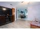 Open living space with wood-look floors, showing access to dining area at 262 Valencia Rd, Debary, FL 32713