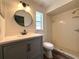 Well-lit bathroom featuring a walk-in shower and vanity at 2709 Queen Palm Dr, Edgewater, FL 32141