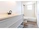 Clean bathroom with a vanity, toilet, and shower/tub combo at 2709 Queen Palm Dr, Edgewater, FL 32141