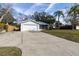 Exterior view of a house with a driveway, garage, and landscaping at 2709 Queen Palm Dr, Edgewater, FL 32141