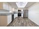 Modern kitchen with white cabinets, granite countertops, and stainless steel appliances at 2709 Queen Palm Dr, Edgewater, FL 32141