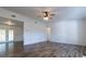 Bright living room featuring hardwood floors and a ceiling fan at 2709 Queen Palm Dr, Edgewater, FL 32141