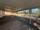 Covered patio provides shaded outdoor space at 2709 Queen Palm Dr, Edgewater, FL 32141