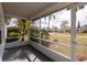 Screened porch overlooking a residential neighborhood at 2709 Queen Palm Dr, Edgewater, FL 32141