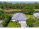 Beautiful aerial view of home featuring a well-manicured lawn and serene water views at 2758 Turnbull Cove Dr, New Smyrna Beach, FL 32168