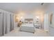 Bright bedroom featuring a comfortable bed and neutral tones at 2758 Turnbull Cove Dr, New Smyrna Beach, FL 32168