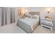 Spacious bedroom with plush bed and elegant decor at 2758 Turnbull Cove Dr, New Smyrna Beach, FL 32168