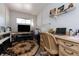 Functional home office with wood desk and comfortable chair at 2758 Turnbull Cove Dr, New Smyrna Beach, FL 32168