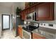 Kitchen features stainless steel appliances and wood cabinets at 2758 Turnbull Cove Dr, New Smyrna Beach, FL 32168