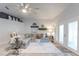 Bright living room featuring a comfortable sectional sofa and French doors at 2758 Turnbull Cove Dr, New Smyrna Beach, FL 32168