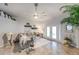 Relaxing living room with gray sectional and ceiling fan at 2758 Turnbull Cove Dr, New Smyrna Beach, FL 32168