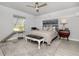 Serene main bedroom with neutral tones and a cozy seating area at 2758 Turnbull Cove Dr, New Smyrna Beach, FL 32168
