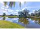 Serene waterfront view of a residential community with lush landscaping at 2758 Turnbull Cove Dr, New Smyrna Beach, FL 32168