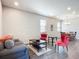 Living room with gray sofa and coral armchairs, and a coffee table at 281 Tuscany Chase Dr, Daytona Beach, FL 32117