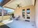 Covered patio with ceiling fan and seating area at 281 Tuscany Chase Dr, Daytona Beach, FL 32117