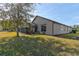 Home's backyard with screened lanai and hot tub at 3169 Connemara Dr, Ormond Beach, FL 32174
