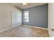 Light and airy bedroom with double door closet and blue accent wall at 3169 Connemara Dr, Ormond Beach, FL 32174
