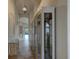 Bright hallway with tile flooring and built-in display cabinets at 3169 Connemara Dr, Ormond Beach, FL 32174