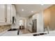 Open kitchen with stainless steel appliances and a view into the dining area at 3169 Connemara Dr, Ormond Beach, FL 32174