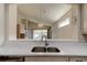 Kitchen features a breakfast bar and a view into the Gathering room at 3169 Connemara Dr, Ormond Beach, FL 32174