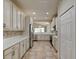 Modern kitchen with white cabinets, quartz countertops, and stainless steel appliances at 3169 Connemara Dr, Ormond Beach, FL 32174