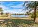 Community lake view with homes and trees at 3169 Connemara Dr, Ormond Beach, FL 32174