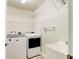 Laundry room with washer, dryer, and ample shelving at 3169 Connemara Dr, Ormond Beach, FL 32174