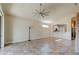 Open living room with views into kitchen and access to lanai at 3169 Connemara Dr, Ormond Beach, FL 32174