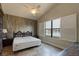 King sized bed, wood accent wall and water view at 3169 Connemara Dr, Ormond Beach, FL 32174