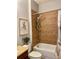 Subdued bathroom with beige tile and shower/tub combo at 3320 Gallia St, New Smyrna Beach, FL 32168