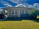 One-story home with landscaped yard and covered porch at 3320 Gallia St, New Smyrna Beach, FL 32168