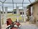 Relaxing screened porch with comfortable seating at 3320 Gallia St, New Smyrna Beach, FL 32168