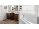 Elegant bathroom with double vanity and garden tub at 337 Orange Ave, Orange City, FL 32763