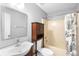 Clean bathroom with shower/tub combo and wood-look flooring at 337 Orange Ave, Orange City, FL 32763