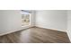Empty bedroom with wood-look floors and a window at 337 Orange Ave, Orange City, FL 32763