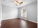 Well-lit bedroom with wood-look flooring and ceiling fan at 337 Orange Ave, Orange City, FL 32763