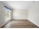 Empty bedroom with wood-look floors and a window at 337 Orange Ave, Orange City, FL 32763