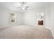 Bright bedroom with neutral walls and carpet flooring at 337 Orange Ave, Orange City, FL 32763