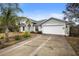 Two-car garage with a long driveway at 337 Orange Ave, Orange City, FL 32763