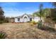 Single story home with gray siding, red mulch, and a two-car garage at 337 Orange Ave, Orange City, FL 32763