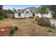 Single-Gathering house with a two-car garage and landscaped yard at 337 Orange Ave, Orange City, FL 32763