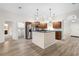 Open concept kitchen with island and stainless steel appliances at 337 Orange Ave, Orange City, FL 32763