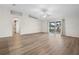 Living room with hardwood floors and access to patio at 337 Orange Ave, Orange City, FL 32763