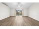 Bright living room featuring hardwood floors and a ceiling fan at 337 Orange Ave, Orange City, FL 32763