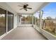Spacious screened porch with ceiling fan and view of backyard at 337 Orange Ave, Orange City, FL 32763